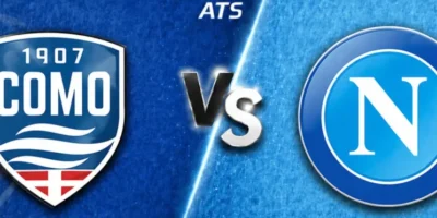 Wide horizontal match preview banner showing Como vs Napoli, split diagonally with a blue textured background. Como’s crest appears on the left, Napoli’s circular “N” logo on the right, with a glowing “VS” in the center and “ATS” text at the top.
