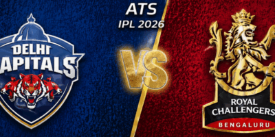 Wide, high-energy IPL 2026 match poster featuring Delhi Capitals vs Royal Challengers Bengaluru: the left side is deep blue with the Delhi Capitals crest (tiger emblem), the right side is bright red with the RCB lion crest, and a glowing gold “VS” sits in the center with “ATS IPL 2026” above, separated by a diagonal gold divider.
