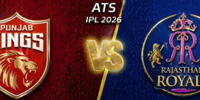 Wide IPL 2026 promotional banner designed for easy horizontal cropping, featuring Punjab Kings on the left in a textured red background with their gold lion crest, and Rajasthan Royals on the right in deep blue with their circular royal crest; a glowing gold “VS” sits in the center beneath “ATS IPL 2026,” divided by a diagonal gold stripe, with star accents in the top corners.