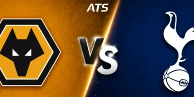 Wide horizontal banner graphic showing Wolverhampton Wanderers vs Tottenham Hotspur, with a gold left side featuring the Wolves wolf-head badge and a navy right side featuring the Spurs cockerel crest, separated by a diagonal split with a glowing “VS” in the center and “ATS” text above, styled as a clean sports matchup promo image.