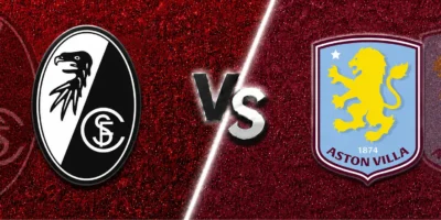 Freiburg vs Aston Villa match banner with both club crests on split red and claret textured backgrounds, separated by a glowing diagonal line and a metallic VS graphic in the center.