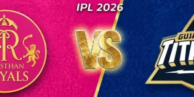 IPL 2026 promotional cricket banner featuring Rajasthan Royals versus Gujarat Titans in a wide-format design optimized for cropping to 1200 x 250. The left side has a textured bright pink background with a slightly smaller Rajasthan Royals circular crest in gold and pink, while the right side uses a dark navy blue textured background with a reduced-size Gujarat Titans logo. A glowing gold “VS” sits in the center beneath “ATS IPL 2026” text, separated by a diagonal gold divider. Small star icons appear in the upper corners, creating a clean, balanced sports-poster aesthetic with extra spacing around the team badges for flexible banner cropping.